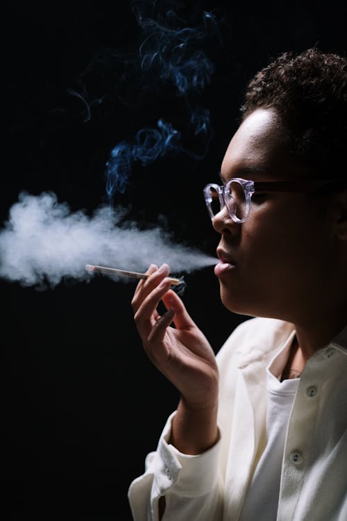 Close-Up Shot of a Woman Smoking