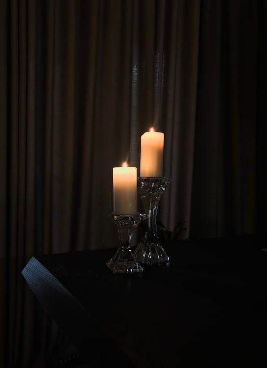 Free Lighted Candles on Candle Holders Stock Photo