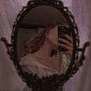 Woman Taking Picture in Mirror