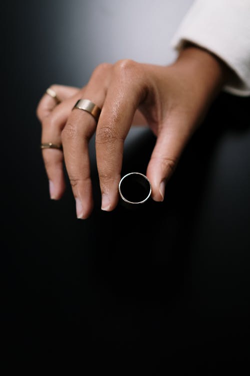 Close-Up Shot of a Person Holding a Ring