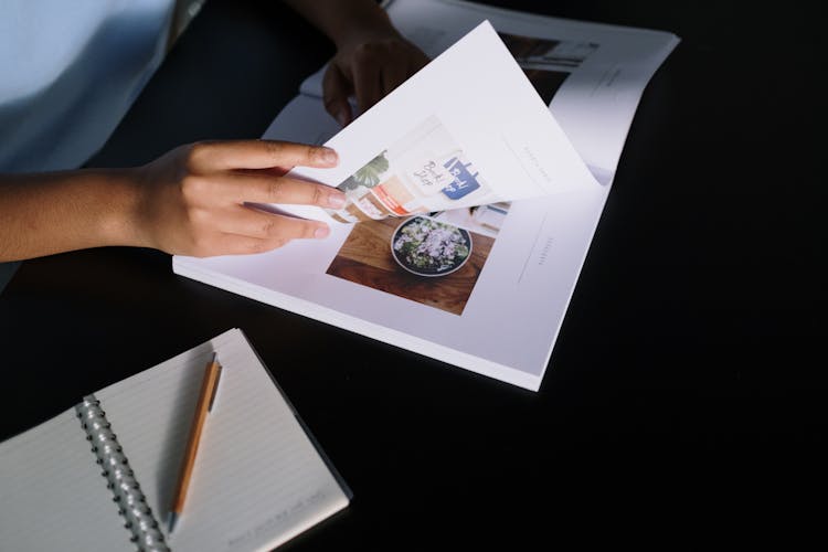 Woman Reading Book At Desk