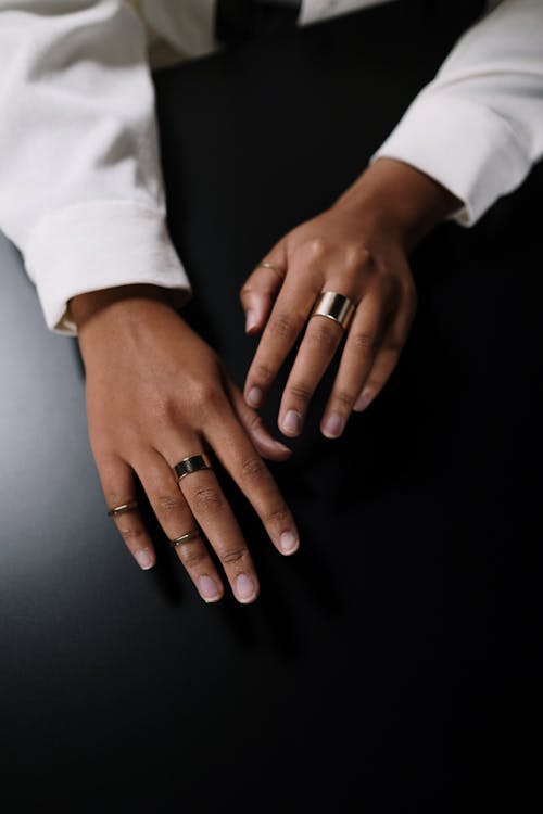 A Close-Up Shot of a Person's Hands with Rings