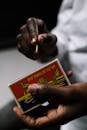 A Person Lighting a Match Stick