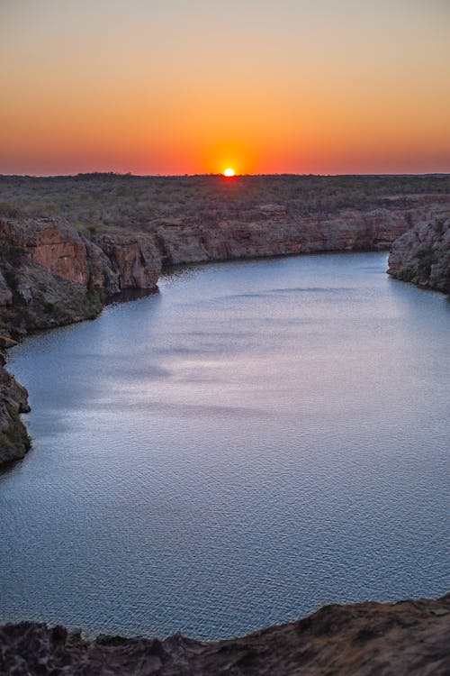 Rocky Cliff Near Body of Water