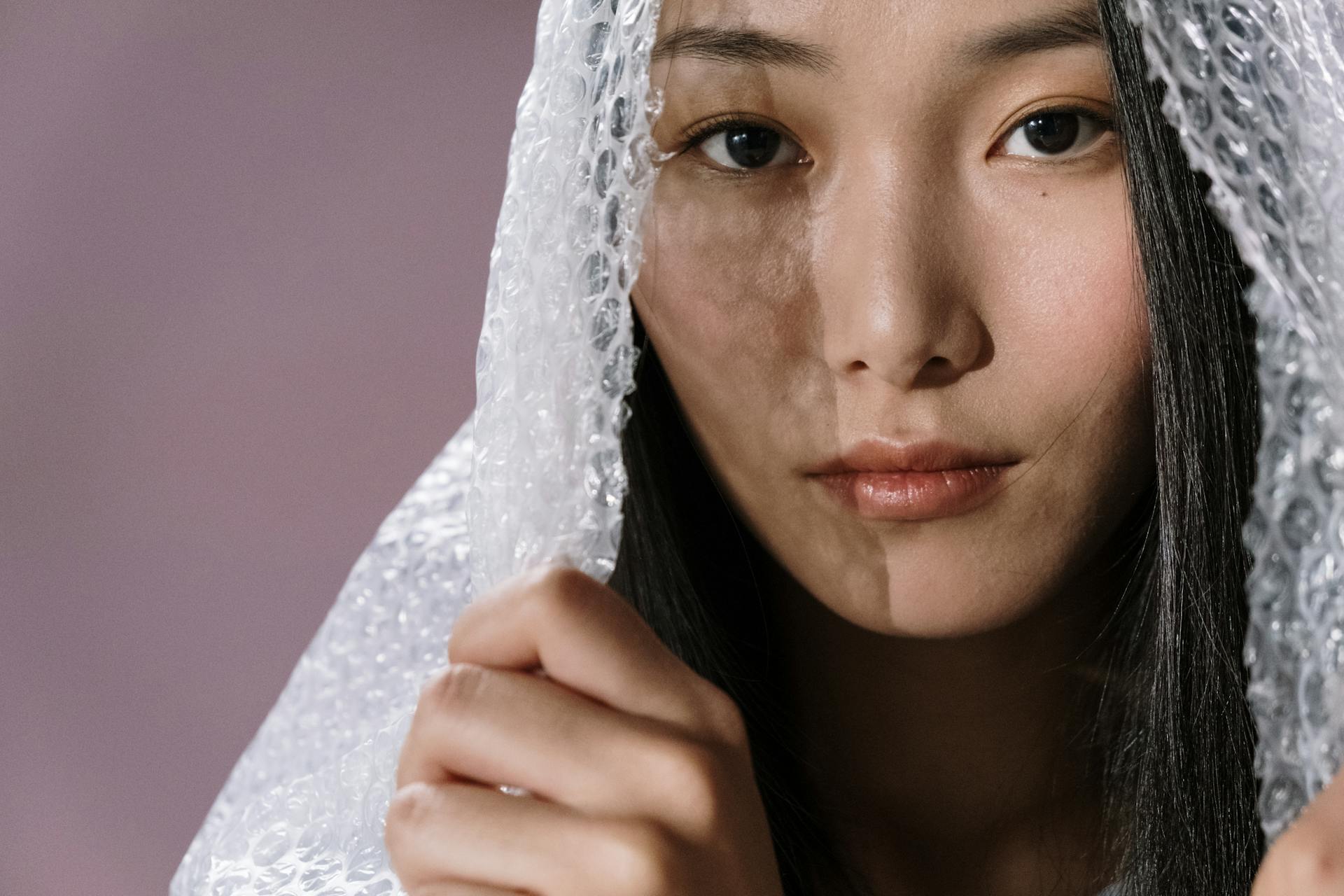 Woman with Bubble Wrap Plastic on Her Head