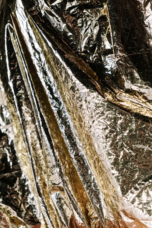 Close-Up Shot of Crumpled Golden Plastic Wrapper