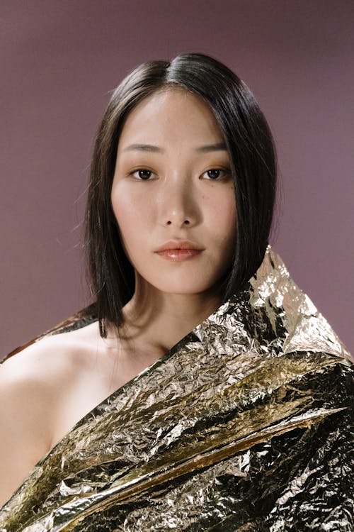 Woman in the Studio Wrapped with Golden Plastic Wrapper