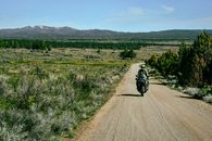 Man Riding Motorcycle on Road