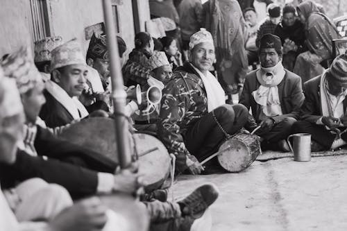 Free Grayscale Photo of People Sitting on Floor Stock Photo