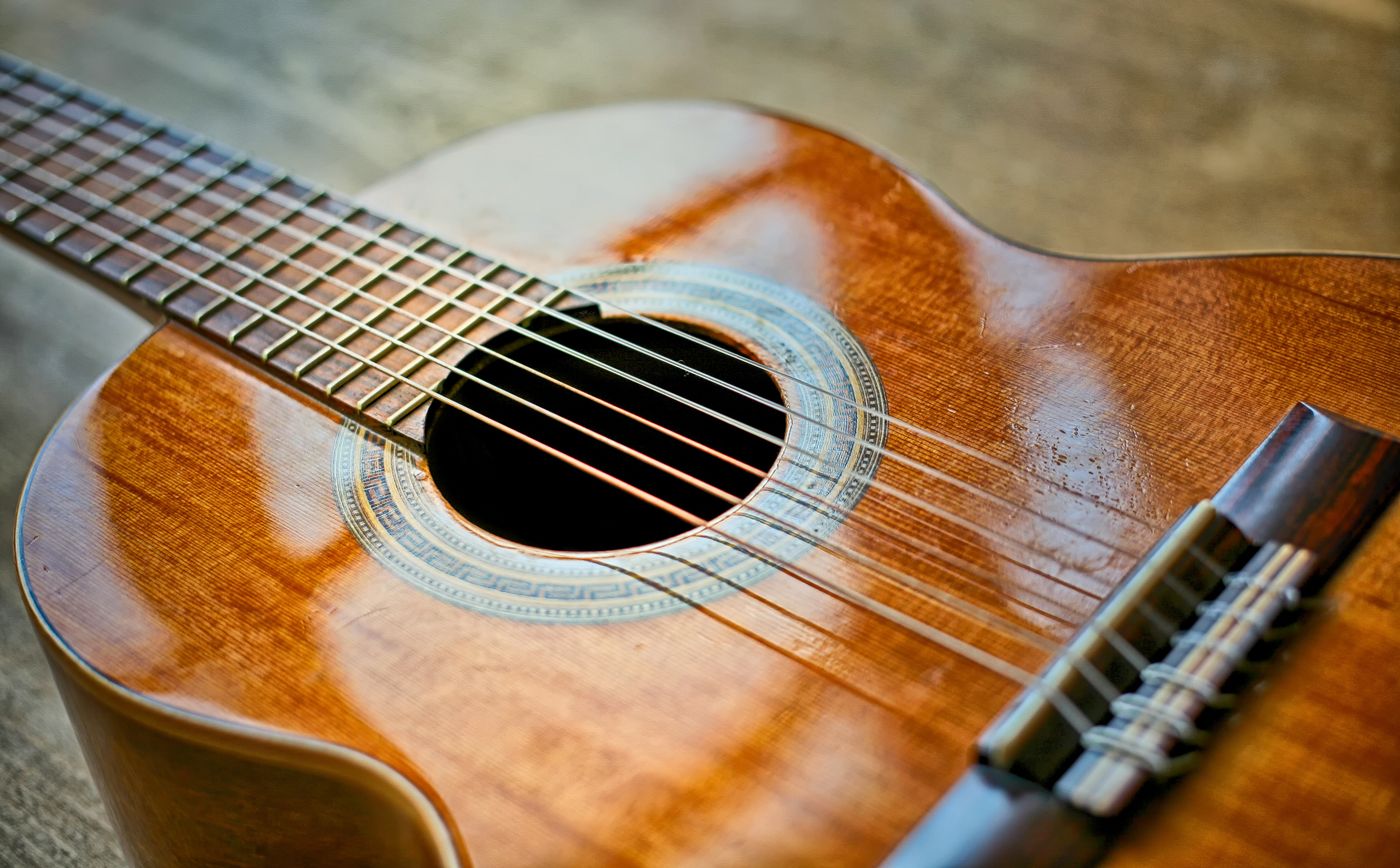 Close-up of a nylon-string classical guitar's strings and soundhole