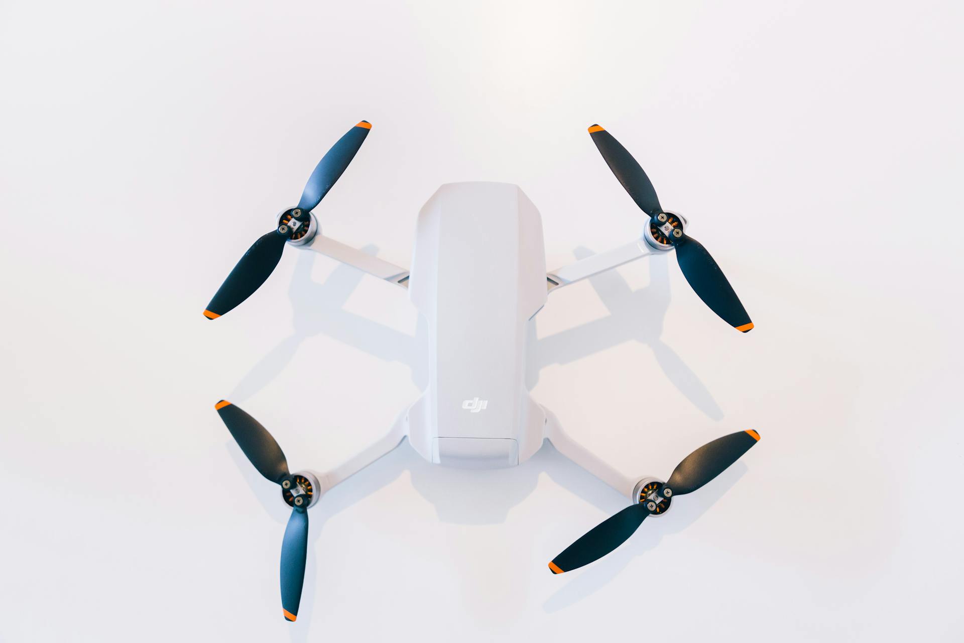 A White Drone with Black Propellers