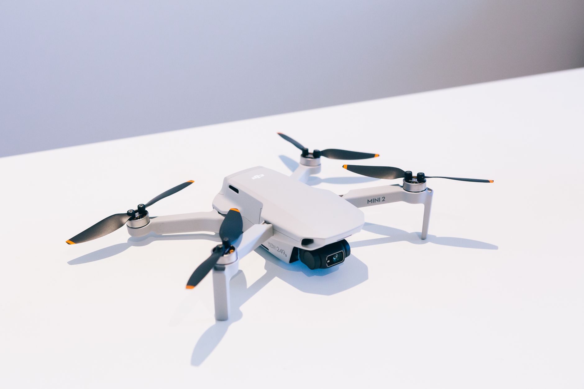 A White Drone with Black Propellers