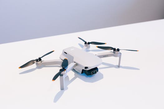 Close-up of a white mini drone highlighting its propellers and sleek design.