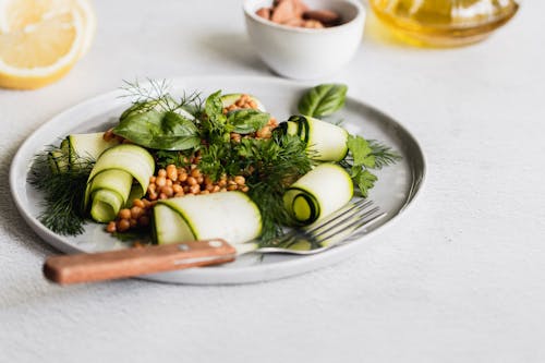 Green Vegetable on White Ceramic Plate