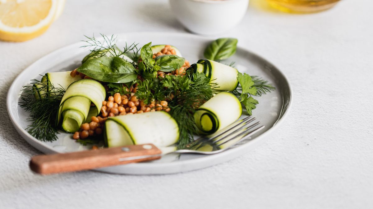 Bulgur bowl with cooked lentils and zucchini