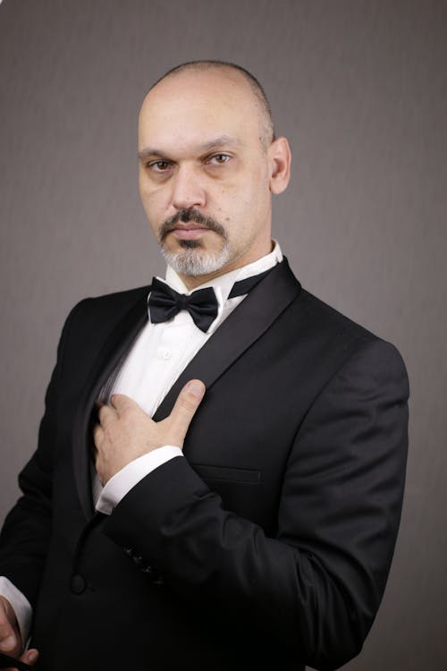 A Bald Man in Black Suit