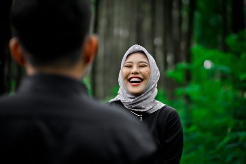 Woman in Gray Headscarf Laughing