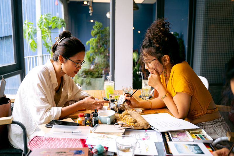 two mugs sitting together on a desk
