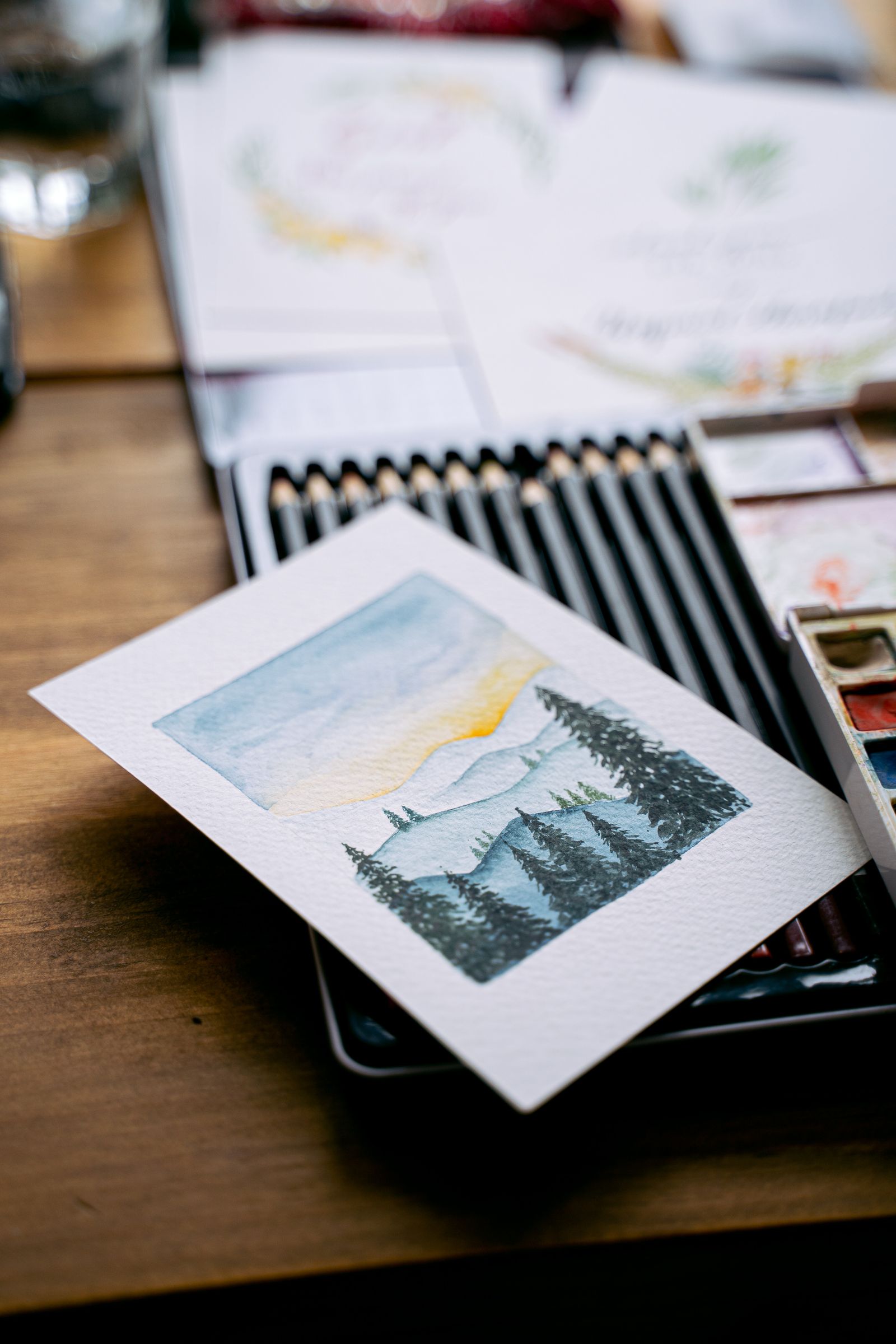 Watercolour and pencils on a worktable