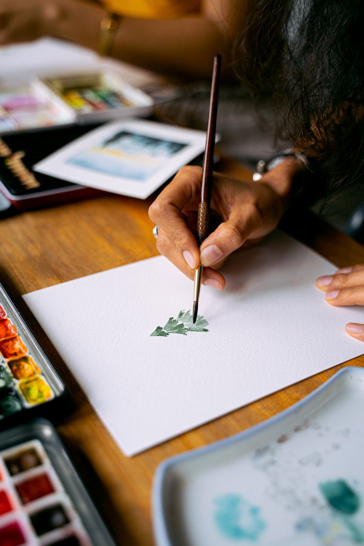 A Painter Painting A Christmas Tree