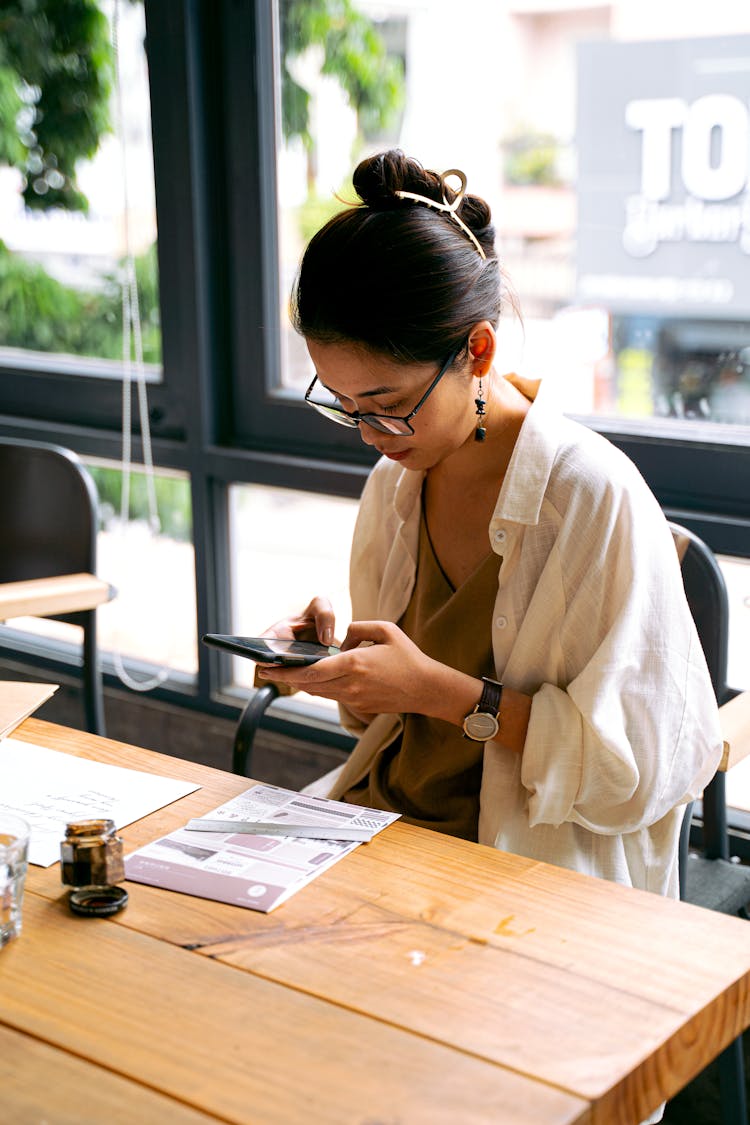 A Woman Using Her Mobile Phone