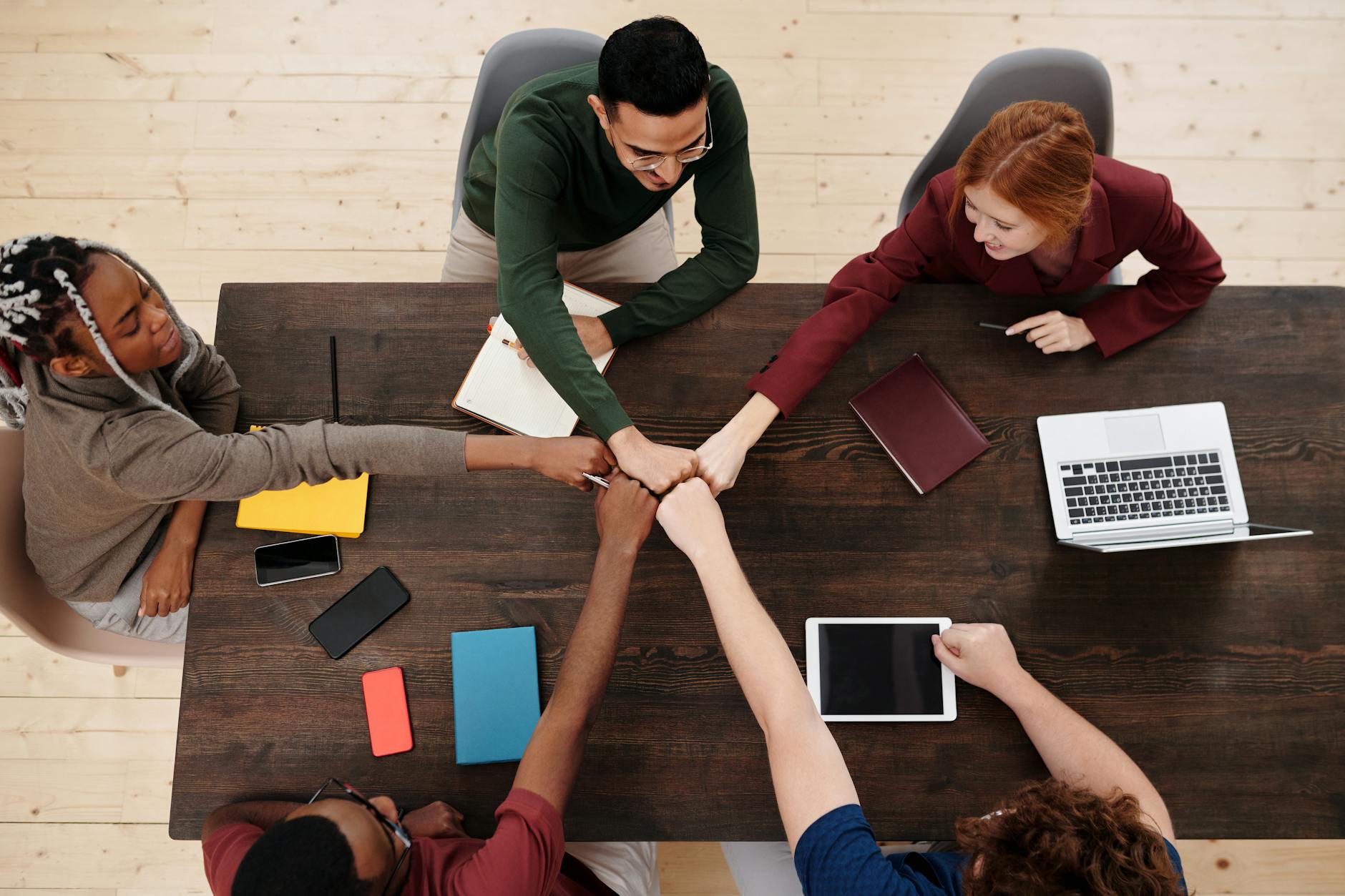 A Group of People Doing Fist Bump