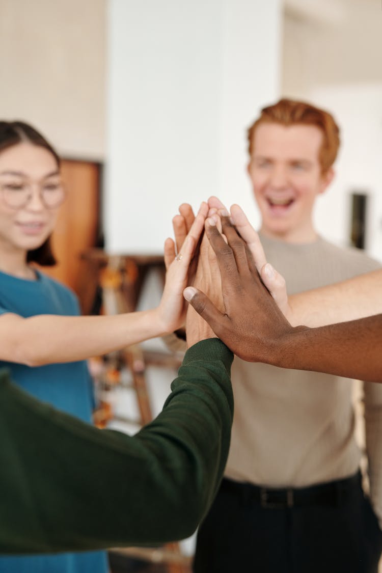 Group Of People Doing High Five