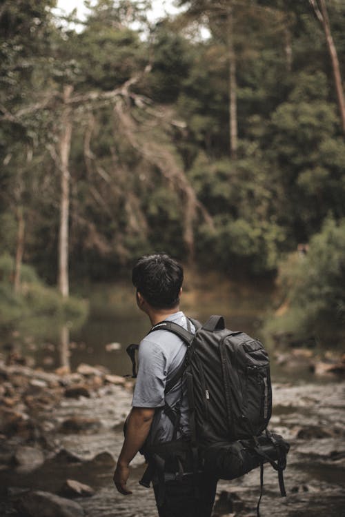 Man with a Backpack in Mountains 