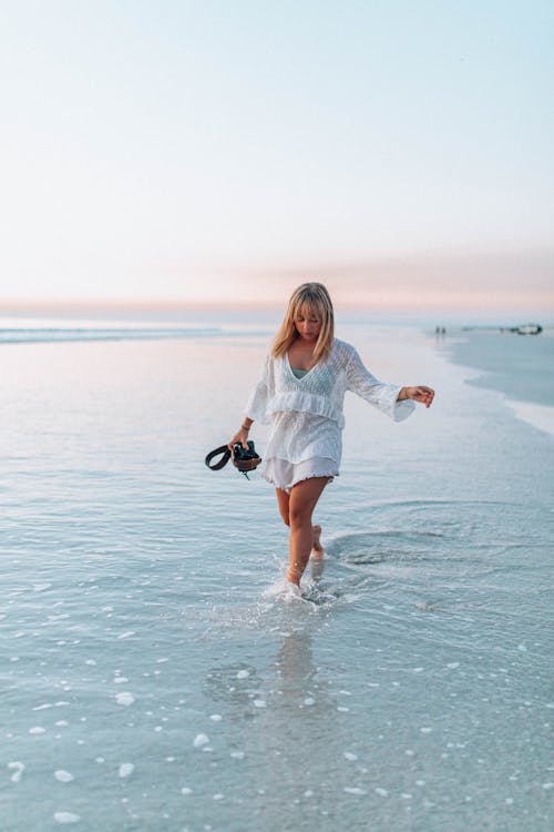 A Woman Walking on Beach