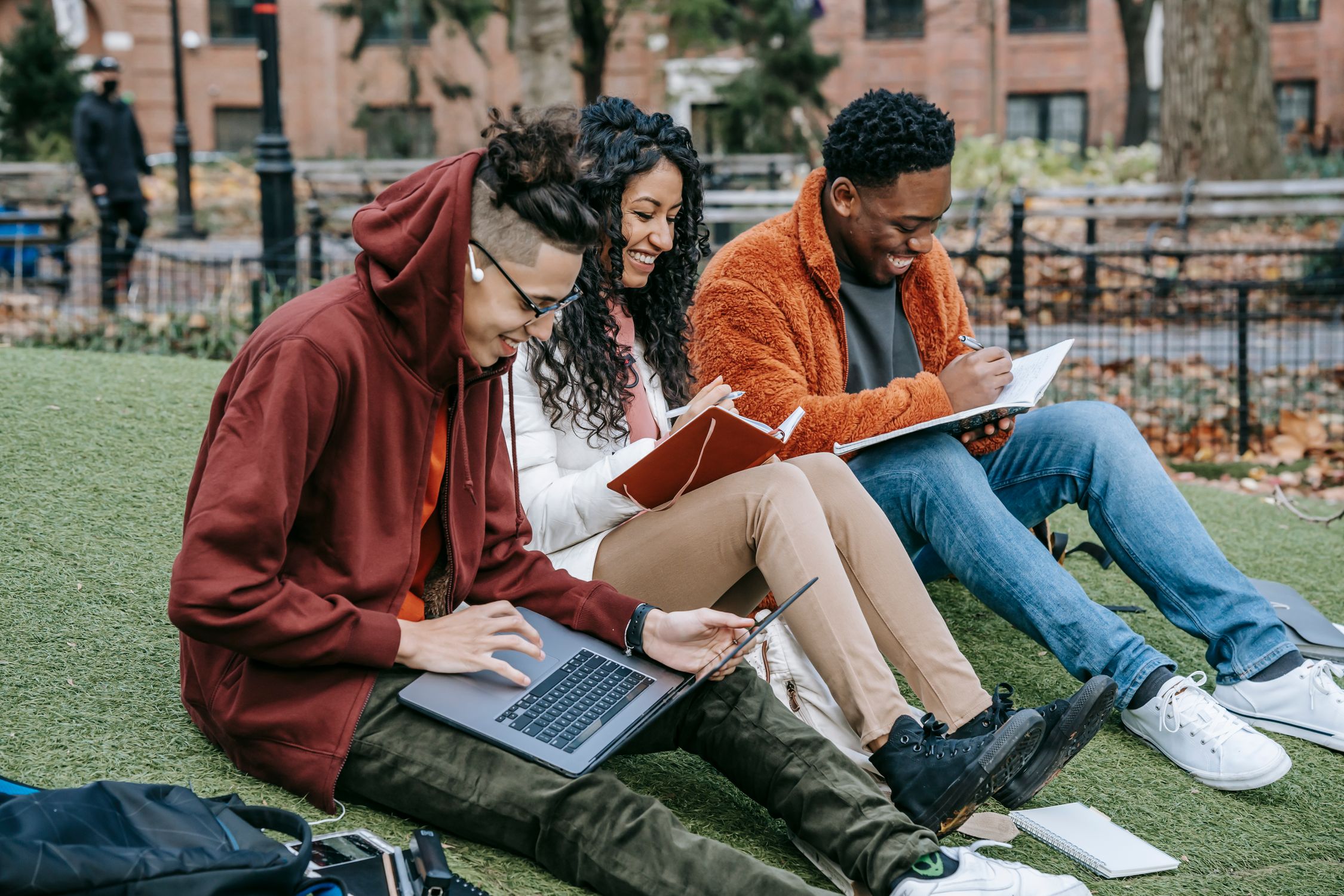Cheerful Diverse Classmates Studying In Park Free Stock Photo Cheerful diverse classmates studying in park free stock photo