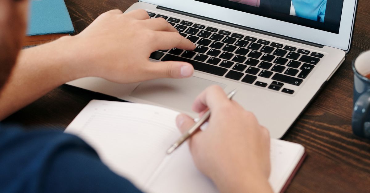 Man in Blue Shirt Having a Virtual Meeting · Free Stock Photo
