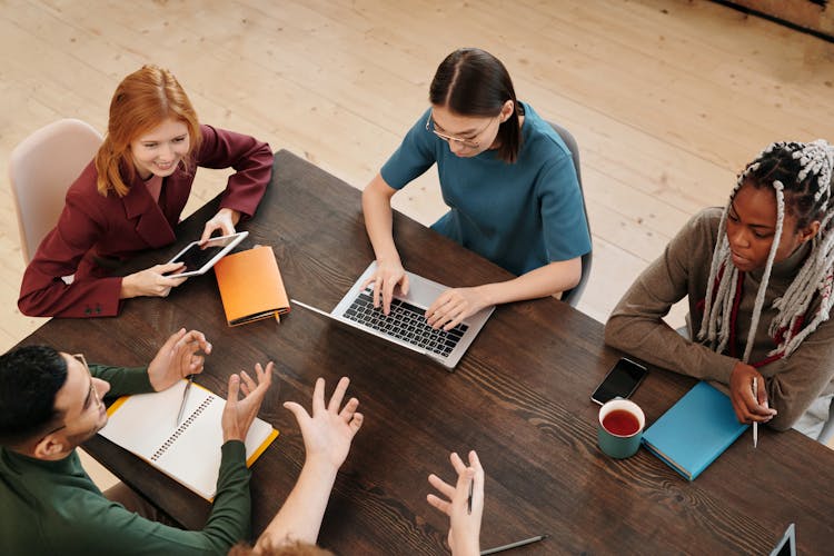 A High Angle Shot Of Colleagues In A Meeting