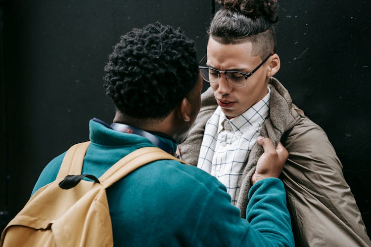 Aggressive Black Man Bullying Ethnic Male Groupmate