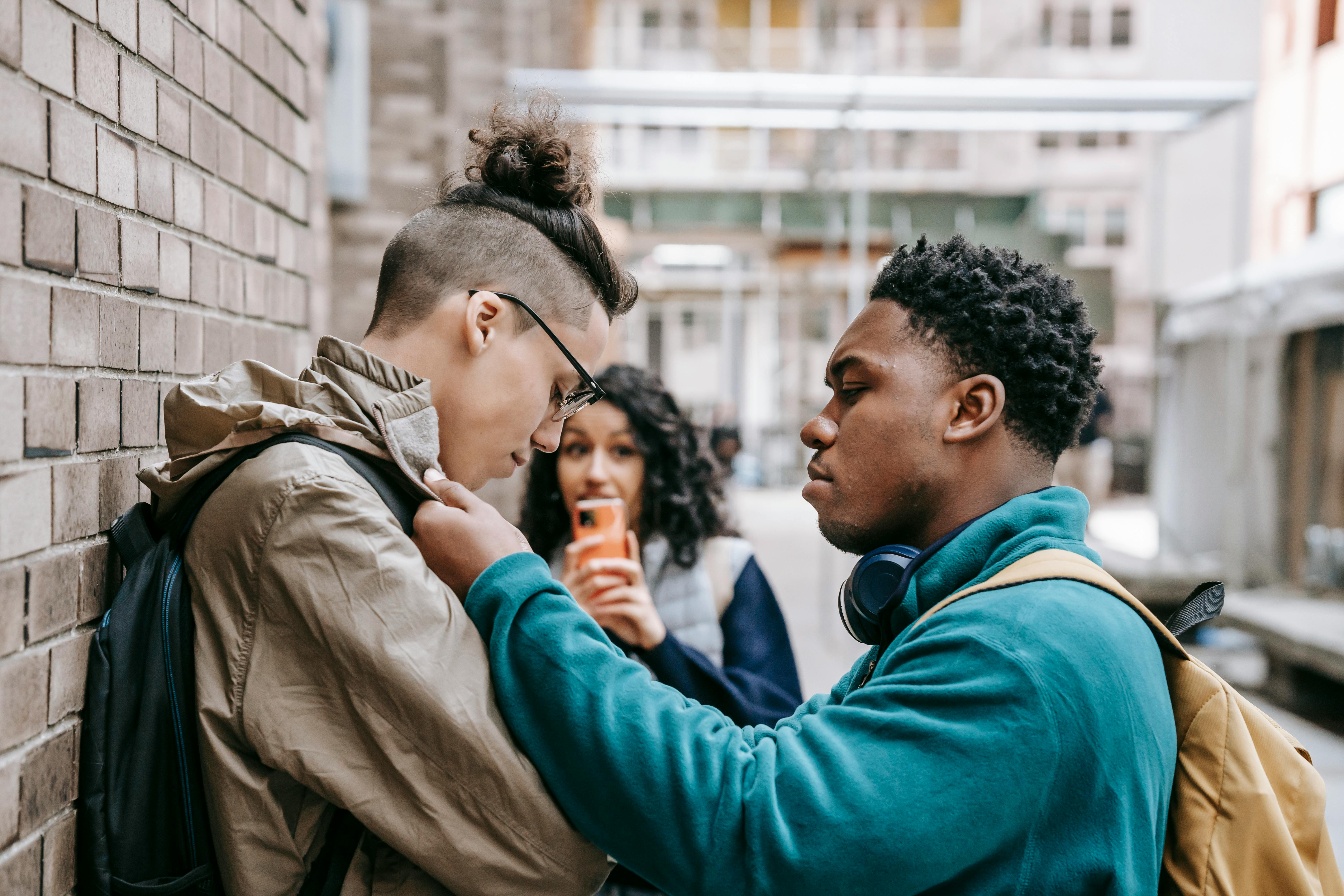 black man grabbing student near university