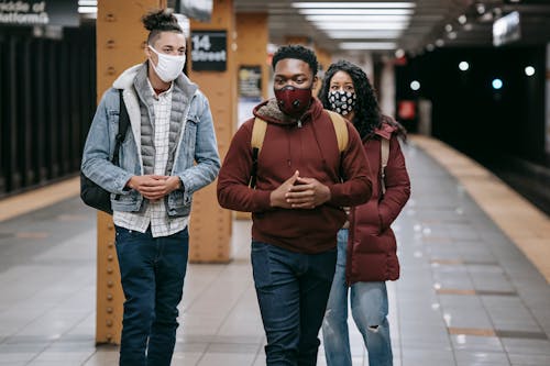 Young multiethnic students in medical masks