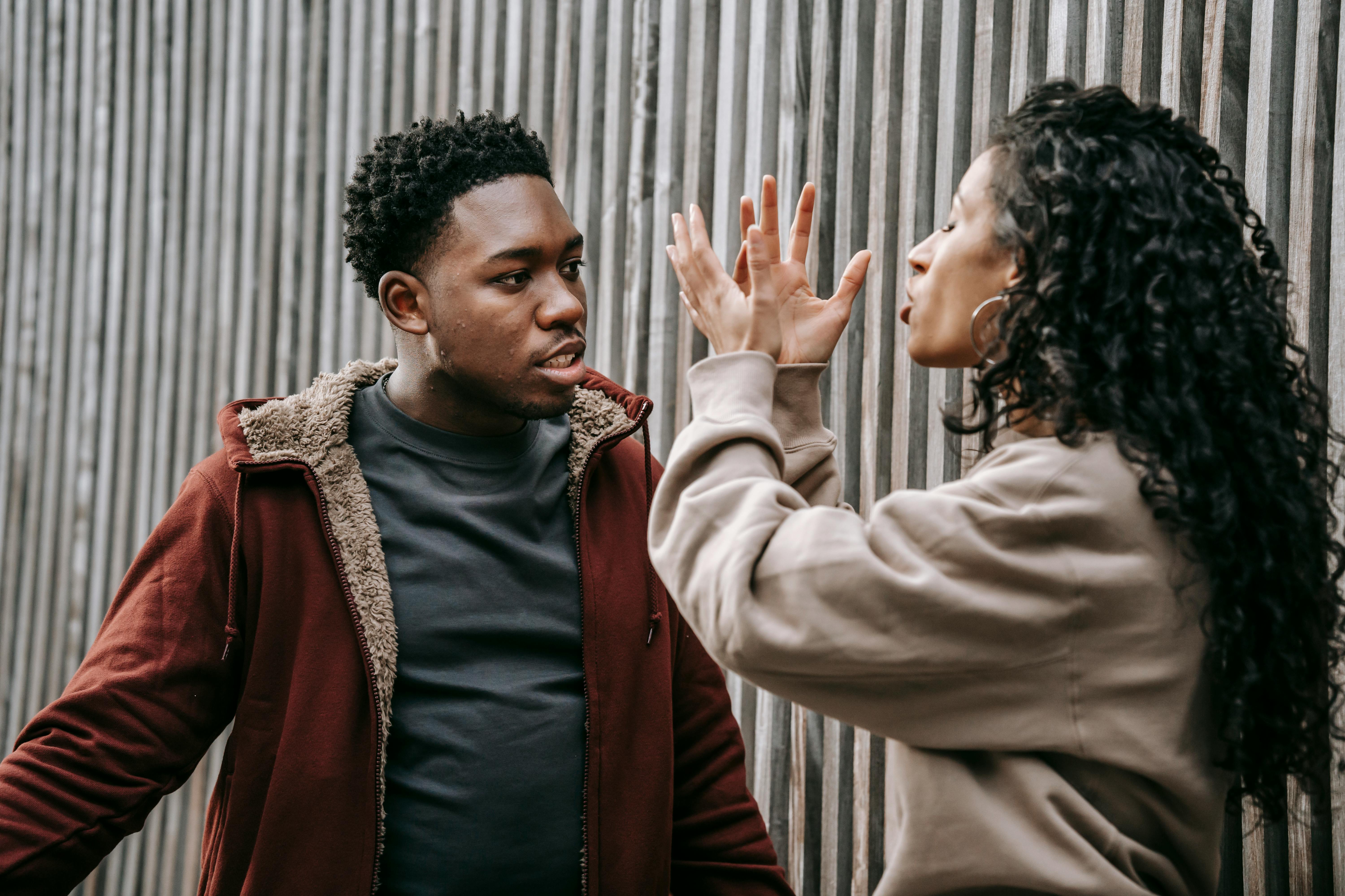 angry multiethnic couple scolding each other during conflict