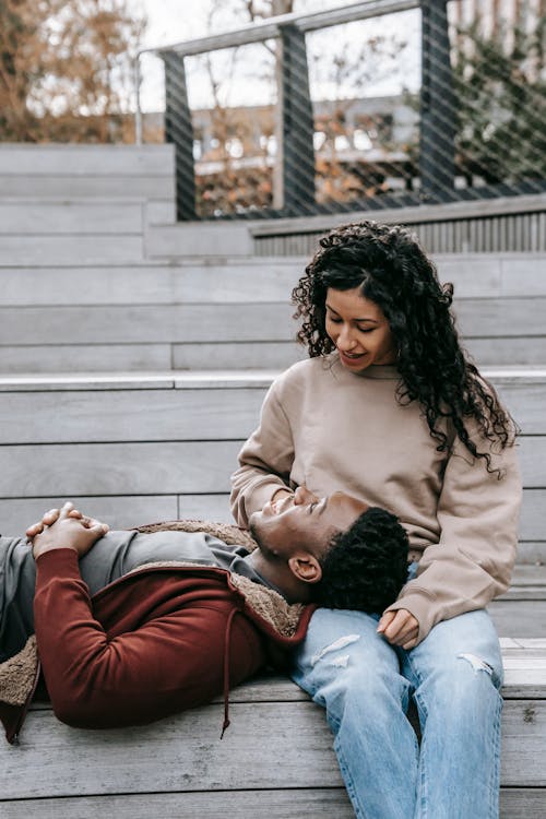 Loving multiethnic couple on wooden stairs