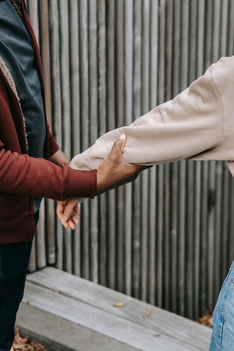 Crop Black Man Grabbing Anonymous Woman