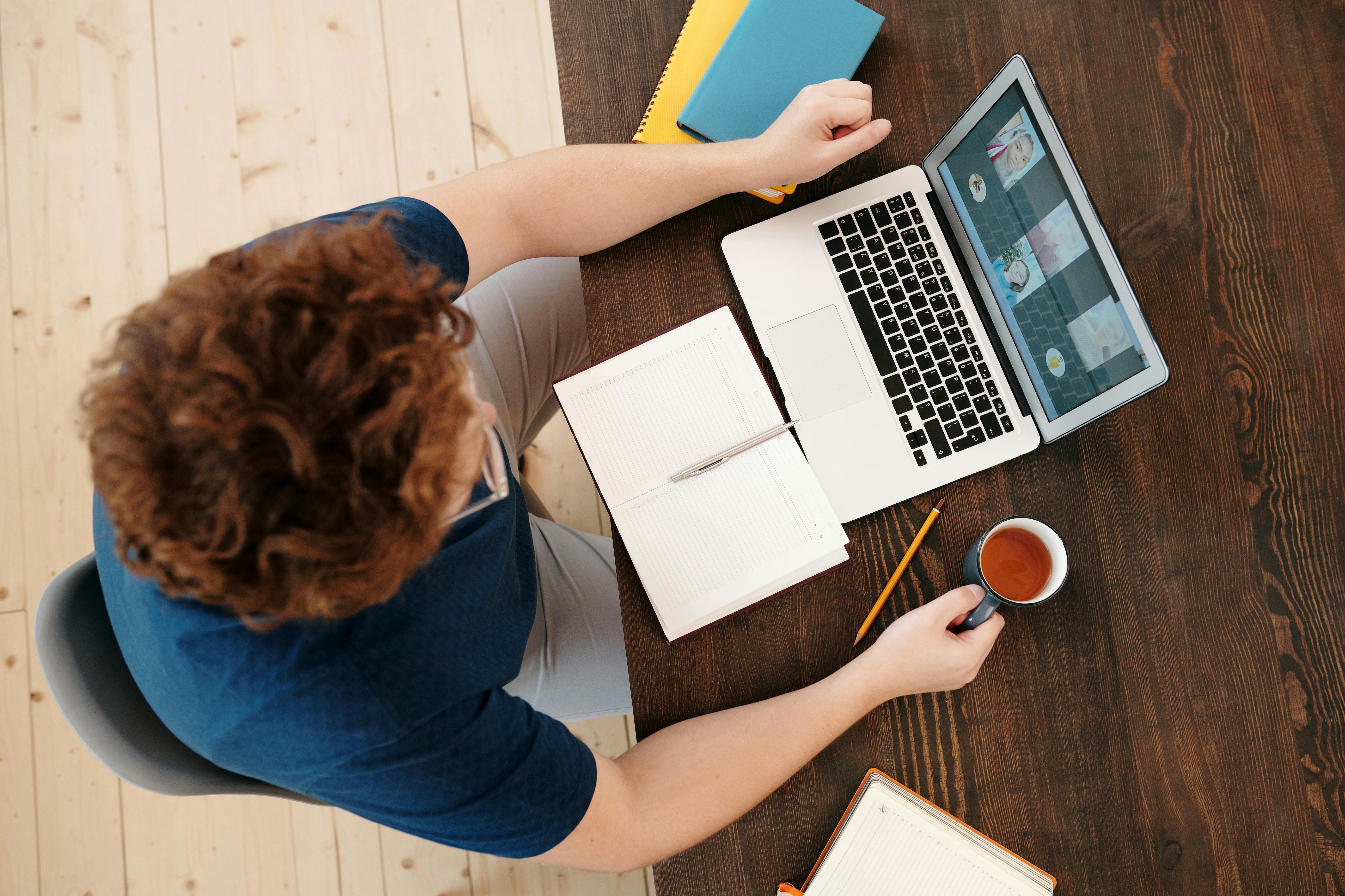 person sitting in front of a laptop