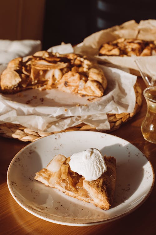 Sliced of Cake with Whipped Cream on Top