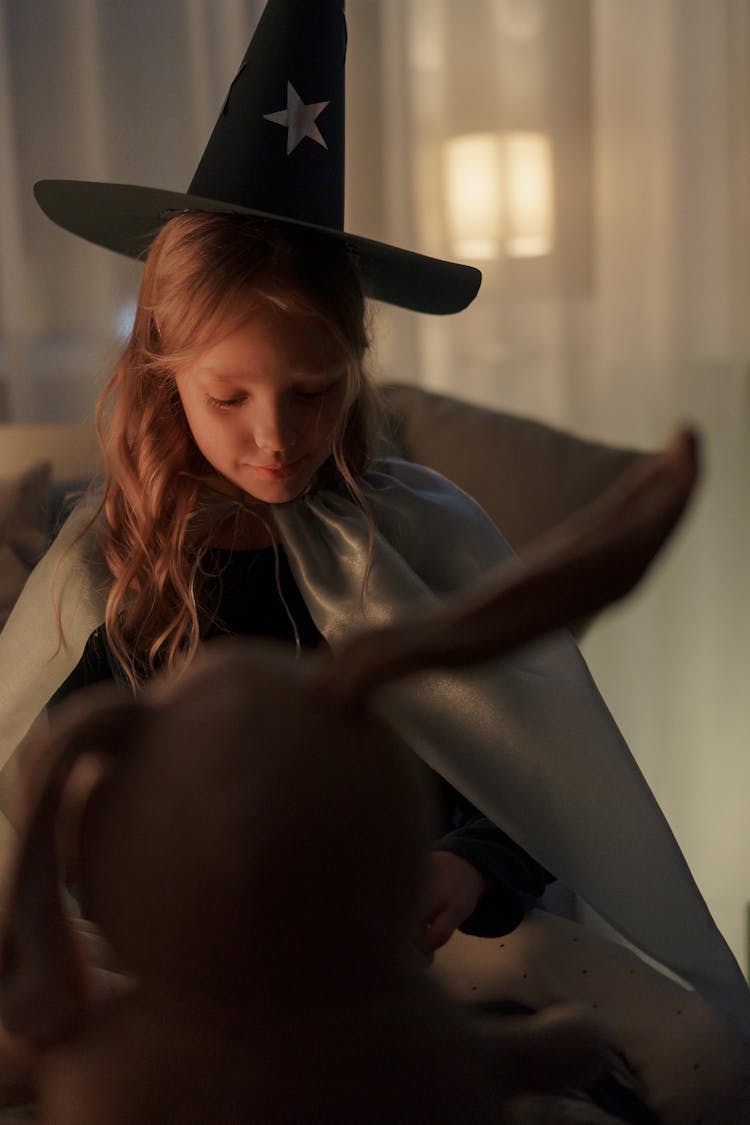 Girl Wearing A Wizard Hat And White Cloak