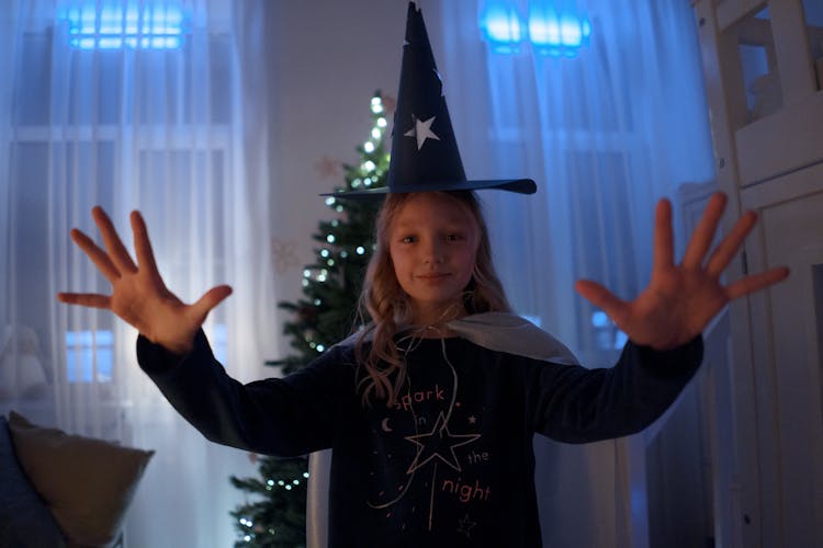  Cute Girl Wearing A Wizard Hat