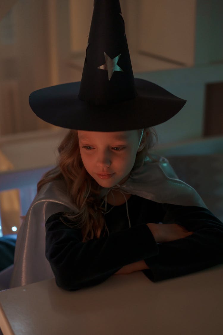 Girl In Black Wizard Hat And White Cloak