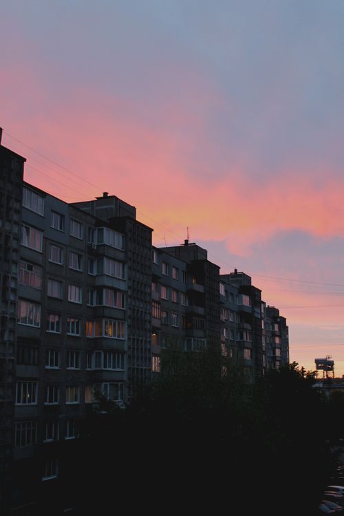Free A dramatic sunset casts vibrant colors over apartment buildings in Kaliningrad, Russia. Stock Photo