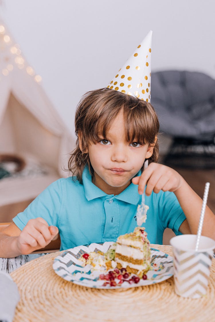 Boy Eating A Cake