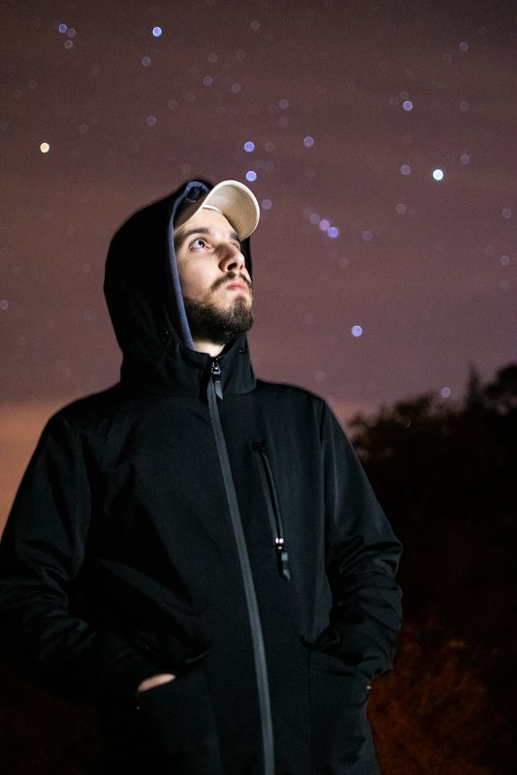 Man In Black Hoodie Looking At The Night Sky