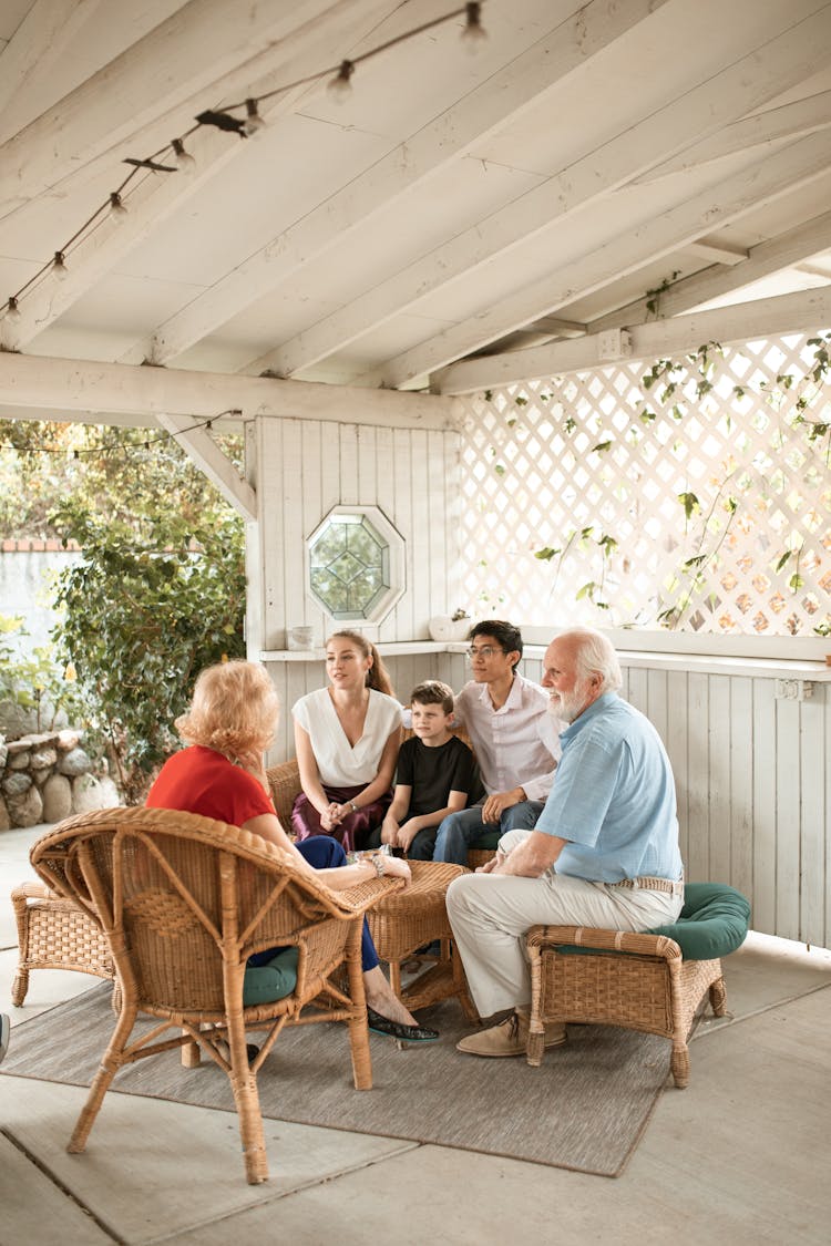 Young Family Talking To Their Parents