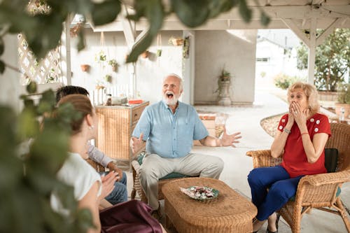 Elderly Couple with Surprised Faces 
Talking to the Family 