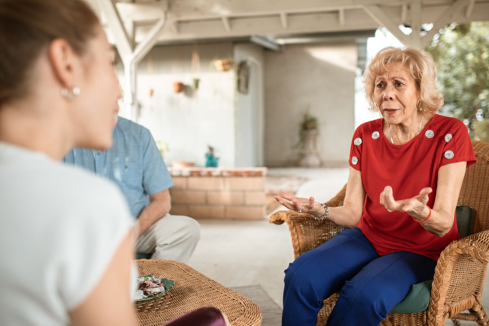 Adult daughter listening while her older mother speaks during a serious family conversation