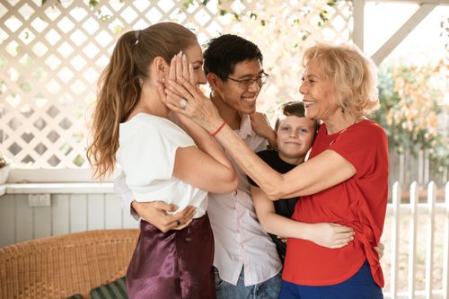 Free A joyful multigenerational family sharing a heartfelt embrace outdoors. Stock Photo
